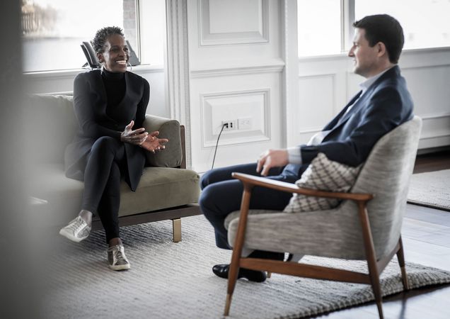 President Melissa Gilliam sitting across from Boston Medical Center CEO Alastair Bell to chat