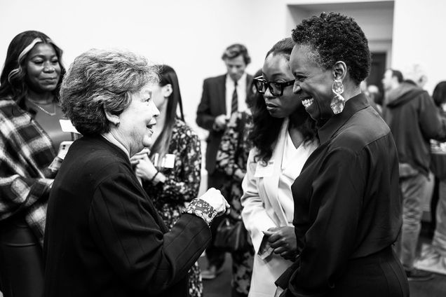 President Melissa Gilliam chatting with a small group of women in Washington D.C.